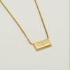 Minimal rectangle necklace in gold stainless steel with engraved Ringstone Symbol by Maconi Jewelry