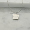 Square stainless steel necklace in silver with engraved Ringstone Symbol by Maconi Jewelry