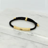 Adjustable silver bracelet with black nylon cord and engraved Ringstone Symbol by Maconi Jewelry