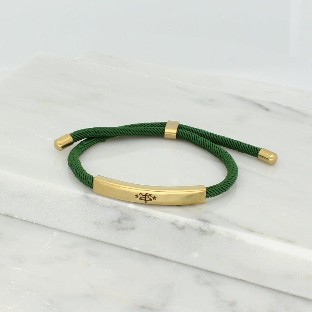 Adjustable gold bracelet with green nylon cord and engraved Ringstone Symbol by Maconi Jewelry