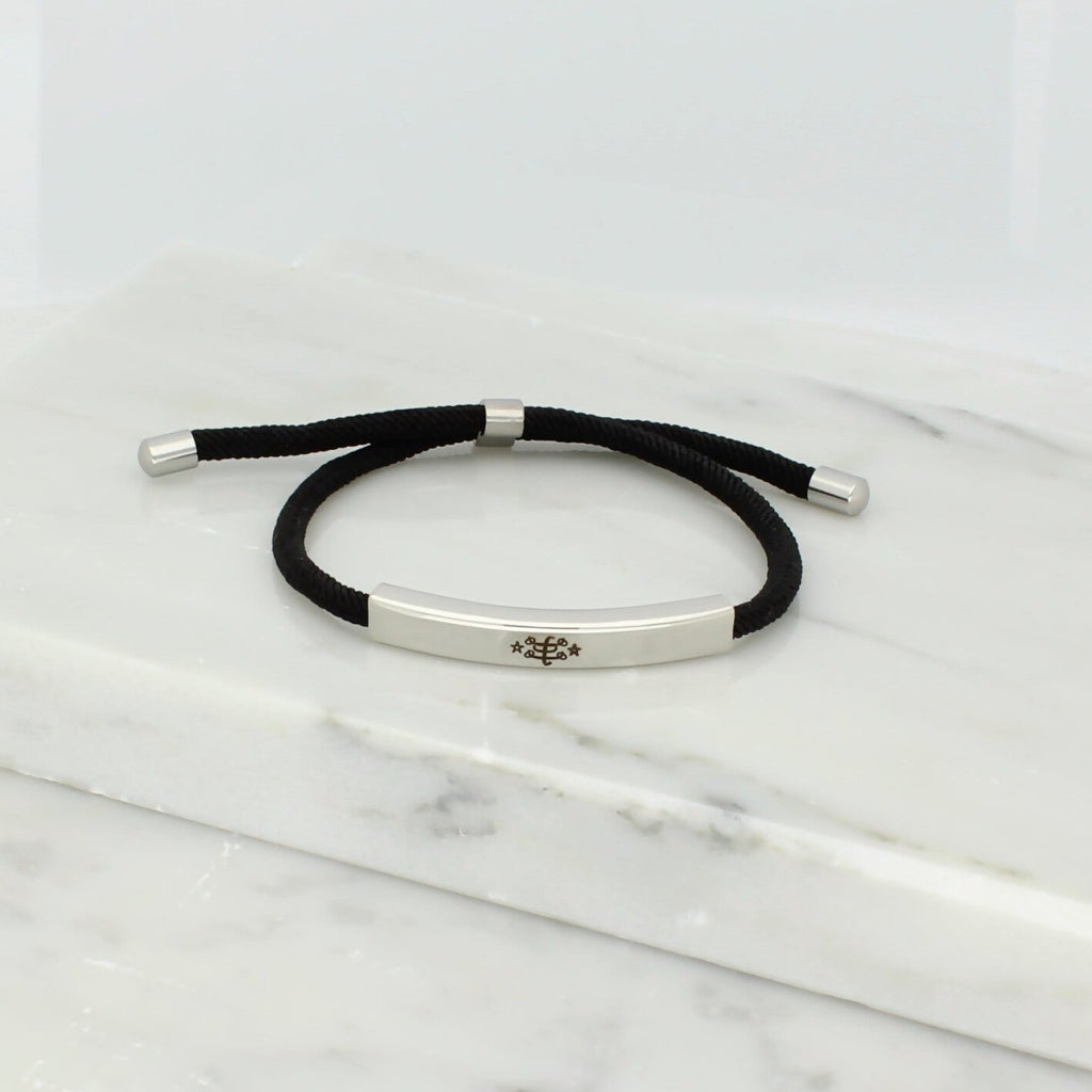 Adjustable silver bracelet with black nylon cord and engraved Ringstone Symbol by Maconi Jewelry
