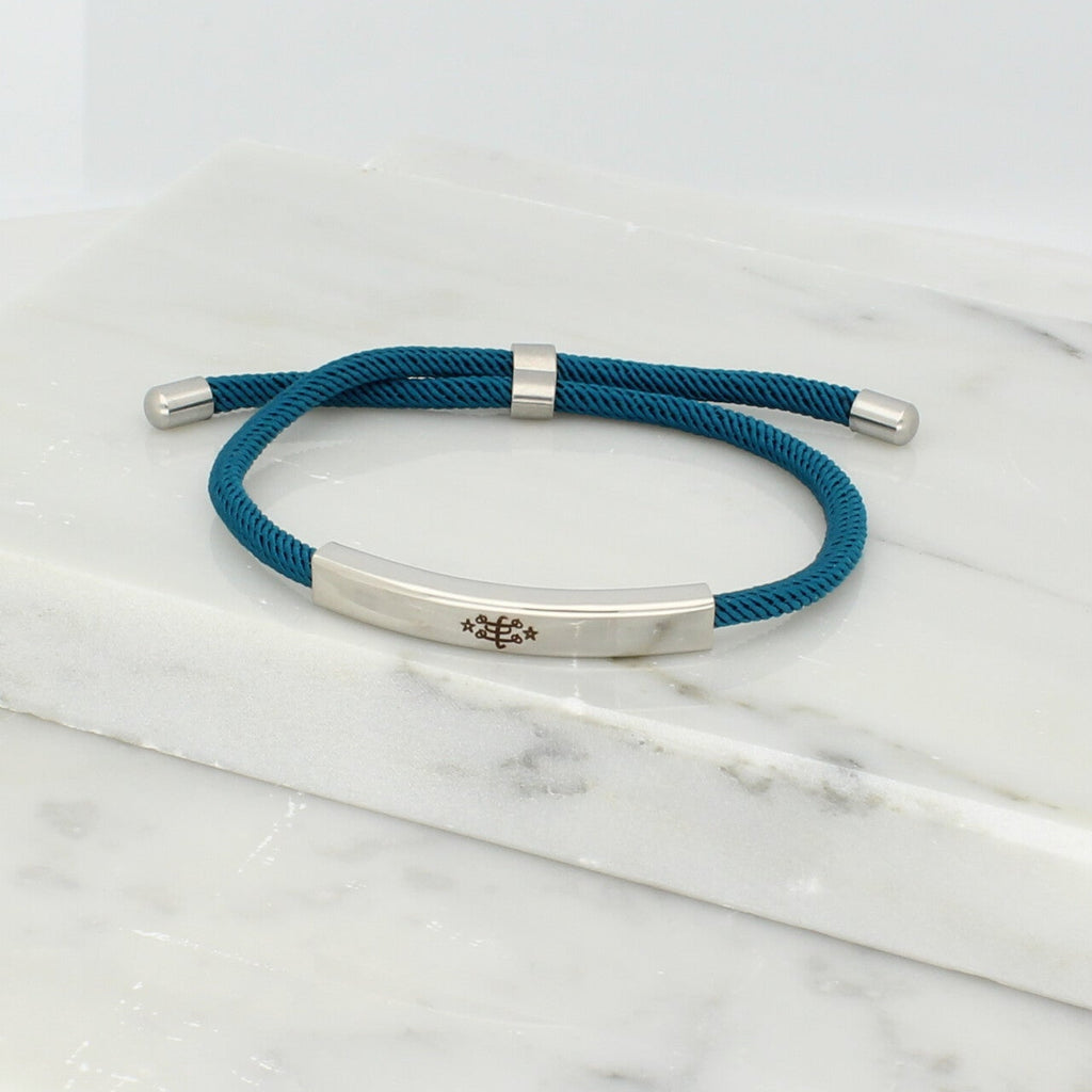 Adjustable silver bracelet with deep teal nylon cord and engraved Ringstone Symbol by Maconi Jewelry