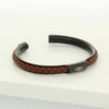 Open black bangle with brown braided leather and engraved Ringstone Symbol by Maconi Jewelry